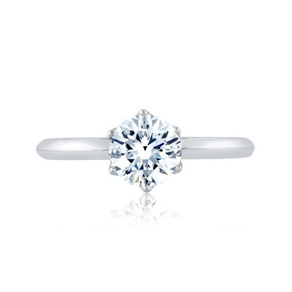 From the Classics collection, this 6 prong solitaire engagement ring features a high shine shank and a touch of pave diamonds under the crown. ME1689/54