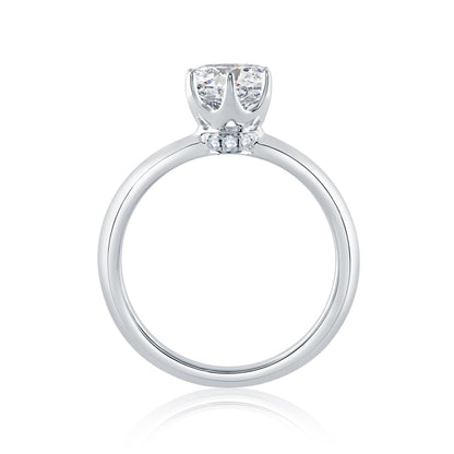 From the Classics collection, this 6 prong solitaire engagement ring features a high shine shank and a touch of pave diamonds under the crown. ME1689/54
